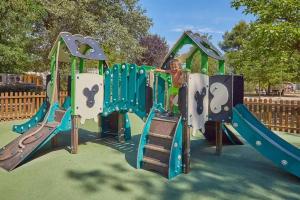 a boy is playing on a playground equipment at PARADIS-ZEN in La Roque-dʼAnthéron