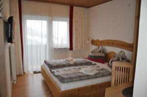 Postel nebo postele na pokoji v ubytování Haus Voithofer