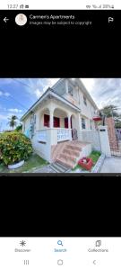 a picture of a house with a picture of it at Carmen's Cozy Studio in Bridgetown