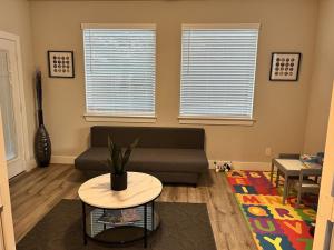 a living room with a couch and a table at New 3 story home *Seaworld/ Lackland in Helotes