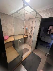 a bathroom with a shower with a glass door at Beautiful appartement. In Cairo Madinaty in Cairo