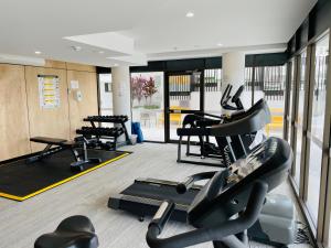 a gym with treadmills and elliptical machines at COASTAL ESCAPE@ The Cosmopolitan Unit 20806 in Maroochydore