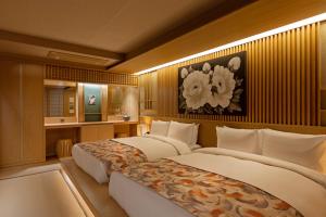 Ліжко або ліжка в номері Hoshikage Ryokan Hotel