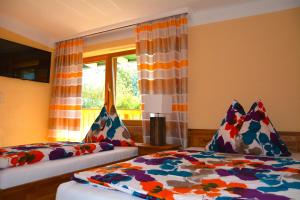 Postel nebo postele na pokoji v ubytování Pension Milan + 12 fotografií