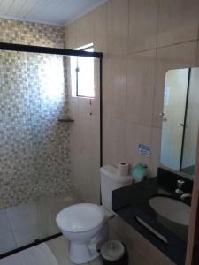 Ένα μπάνιο στο Pousada Por Do Sol chalés Monte Verde