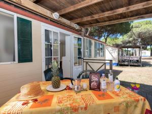 a table with a pineapple on top of it at Mobile Home in Cesenatico by Adriatic Sea in Cesenatico
