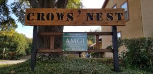 a sign that says arrows nest in front of a building at Lovely 2 bed Condo with pool and lake nearby in Garland