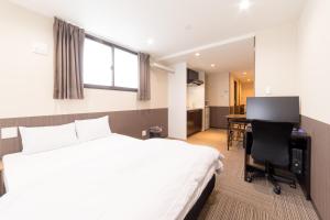 Uma cama ou camas num quarto em Le Studio 五条高倉