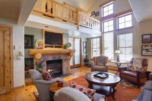a living room with a fireplace and a tv at 3 Bedroom Condo - The Lodges at Deer Valley condo in Park City