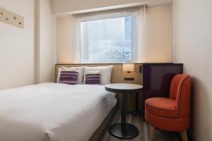 Postel nebo postele na pokoji v ubytování Hotel Vista Fukuoka Nakasu-Kawabata