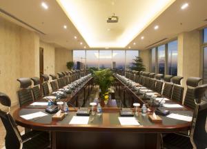 a large conference room with a long table and chairs at Mariana Hotel Erbil in Erbil