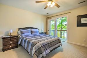 a bedroom with a bed and a ceiling fan at Ideal Chickamauga Lake Home and Dock and Fire Pit in Soddy-Daisy