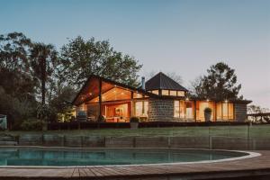 a house with a pool in front of it at Kangaroo Manor in Yarra Junction