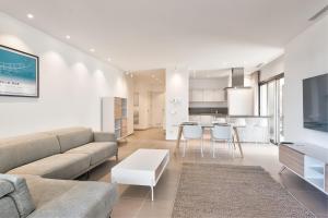 a living room with a couch and a table at Jardines - Tabor 2 1 POOL VIEW 2B in Palm-Mar