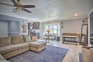 a living room with a couch and a table at Family-Friendly Baton Rouge Abode with Patio! in Baton Rouge