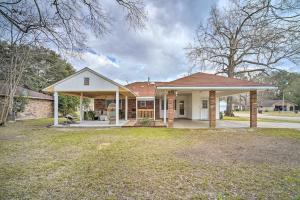 a home with a brick house with a yard at Family-Friendly Baton Rouge Abode with Patio! in Baton Rouge