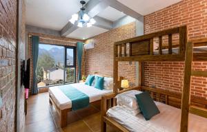 Krevet ili kreveti u jedinici u okviru objekta Leisurely River View Inn - Three Gorges Branch