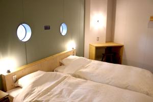 Postel nebo postele na pokoji v ubytování Hostel Tomar