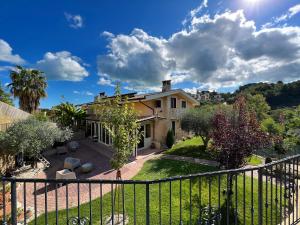 a view of a house with a fence at Peperosa in collina B&B in Pescara