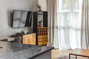 Televízia a/alebo spoločenská miestnosť v ubytovaní Jurajska 4 by Homeprime
