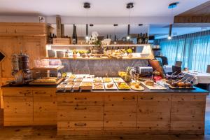 a buffet line with many different types of food at Hotel Alcialc in La Valle