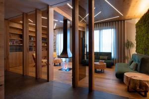 a living room with a couch and a table at Sport Village Hotel & Spa in Castel di Sangro