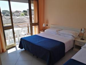 Postel nebo postele na pokoji v ubytování Hotel Elizabeth