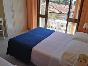 Postel nebo postele na pokoji v ubytování Hotel Elizabeth