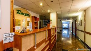 a long hallway of a pharmacy with a long counter at Anomis in Cîmpulung