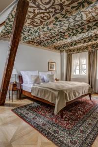 Postel nebo postele na pokoji v ubytování Hotel Nerudova 211