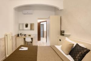 Postel nebo postele na pokoji v ubytování Cola Di Rienzo Suite Guest House