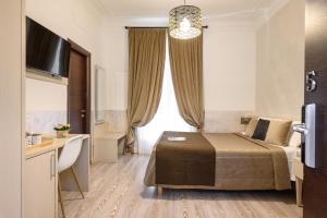 TV a/nebo společenská místnost v ubytování Cola Di Rienzo Suite Guest House