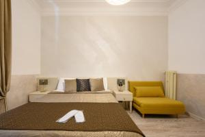 Postel nebo postele na pokoji v ubytování Cola Di Rienzo Suite Guest House + 37 fotografií