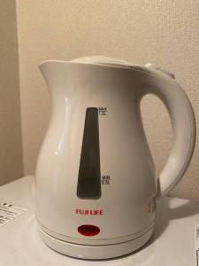 a white kettle with at 副都心線池袋駅C1出口から徒歩3分 1か月以上のご予約は6割Off in Tokyo