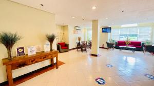 a lobby of a hospital with a waiting room at Microtel by Wyndham Tarlac in Tarlac