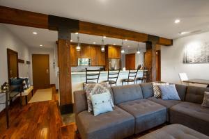 a living room with a couch and a kitchen at 1 Bedroom Condo with Spa - Silver Baron Lodge condo in Park City
