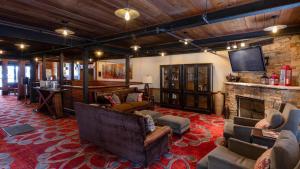 a large living room with couches and a fireplace at 1 Bedroom Condo with Spa - Silver Baron Lodge condo in Park City