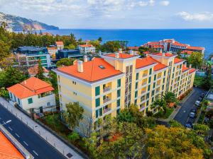 an aerial view of a large building with orange roofs at Lido Gardens Funchal in Funchal