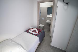 Postel nebo postele na pokoji v ubytování Residenza Jerocades