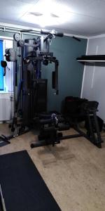a room with a gym with several tread machines at Örnvik Hotell & Konferens in Luleå