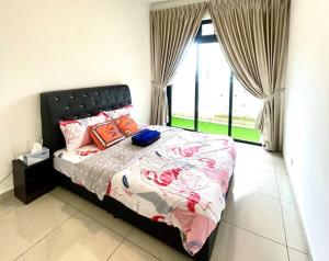 a bedroom with a bed and a large window at Legoland JB AGhome Medini 3room8pax bukit indah in Nusajaya +65 photos