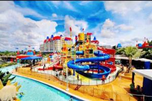 a water park at a resort with a water slide at Legoland JB AGhome Medini 3room8pax bukit indah in Nusajaya