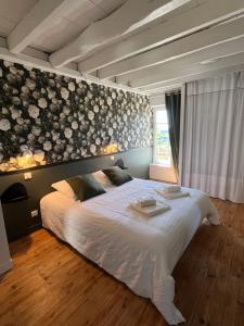 Katil atau katil-katil dalam bilik di La Vigne - Maison de charme avec piscine +19 gambar