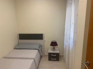 Postel nebo postele na pokoji v ubytování Atlantica Apartment + 13 fotografií