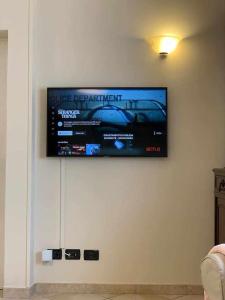 TV a/nebo společenská místnost v ubytování Appartamento sul porto Nettuno