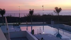 a swimming pool with a view of the ocean at Panorama Beach - Blue Horizon in Torrox Costa +11 photos