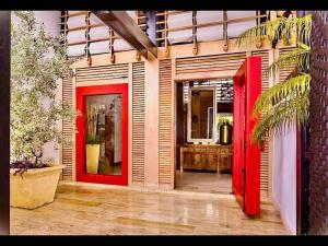 a red door of a house with at Srvittinivillas Cn-ll66 Great Villa Good Location Casa de Campo Resort Villa in La Romana