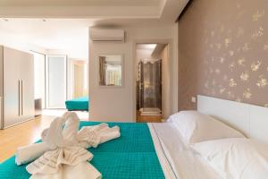 Posteľ alebo postele v izbe v ubytovaní Saija Apartment