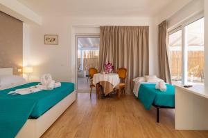 Posteľ alebo postele v izbe v ubytovaní Saija Apartment