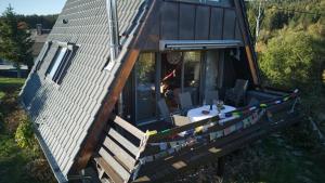 an aerial view of a tiny house with a porch at Haus Fichtelgebirge in Nagel